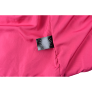 Close-up view of the interior branding label on the authentic SP5DER Real Tree Puffer Vest, showcasing the logo.