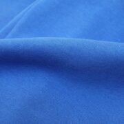 Close-up view of the premium royal blue fabric used for Sp5der Websuit sweatpants, highlighting the soft texture.