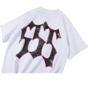 The white Sp5der Juan V2 t-shirt showing the back side with a bold black graphic print inspired by Juan Manuel Fangio.