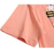 Close up of the premium peach fabric and vibrant graphic design on the Sp5der Print tee-shirt for streetwear fans.