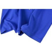 Close-up view of the premium royal blue cotton fabric texture on the Sp5der OG Web V2 streetwear graphic t-shirt.