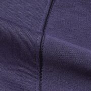 Close-up view of the premium navy-blue fabric used for the Sp5der Beluga Sweatpant, showing its high-quality texture.