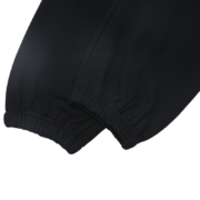 A detailed close-up shot showing the cuffed leg hem of the SP5DER Black OG Web Sweatpants in premium black.