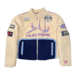 Front view of the beige and navy Sp5der Worldwide Hunters Sherpa Moto Jacket with branded patches and zipper.