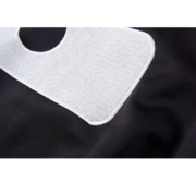 Close up of the premium white embroidered branding detail on the black fabric of the Sp5der G550 performance jacket.