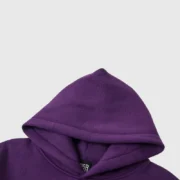 Close-up view of the hood on a purple Sp5der Star OG Web V2 streetwear hoodie with high-quality fleece construction.