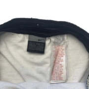 Interior tag detail inside the elastic waistband of the Sp5der print shorts showing size and manufacturing details.