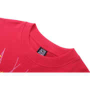 Close-up view of the collar and iconic web graphic on a vibrant pink Sp5der T-shirt for a casual summer look.