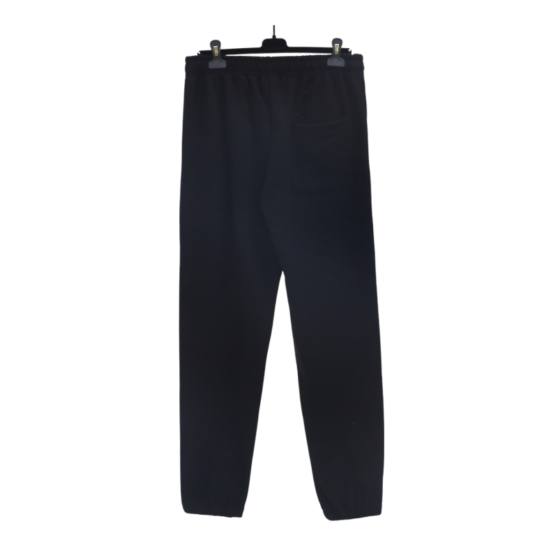 Back view of black Sp5der Jeffery sweatpants featuring a relaxed fit, elasticated waistband, and premium construction.