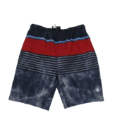 Sp5der swim trunks featuring a bold color-blocked design with stripes, an adjustable waistband, and the iconic logo.
