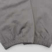 Close-up view of the premium heavyweight 13oz cotton fleece fabric on the Sp5der 5Ex Sweatpants in Slate Grey color.