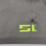 Close-up of the Sp5der 5Ex Slate Grey hoodie featuring signature puff print spider web and lettering graphic detail.
