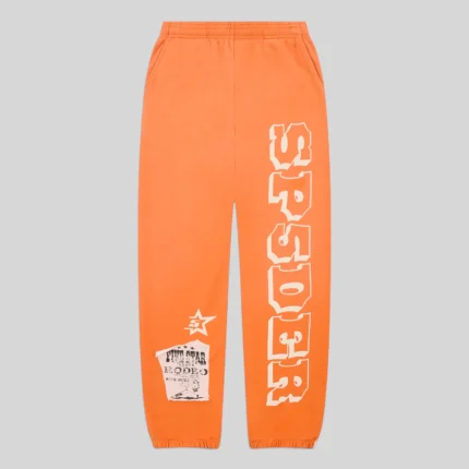 Front view of orange Sp5der 5Star Rodeo sweatpants featuring a large SP5DER logo print and a distressed patch design.