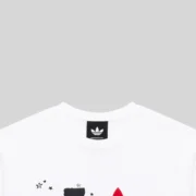 Close up view of the Sp5der x Adidas Souvenir Tee in white featuring a branded collar and detailed graphic print.