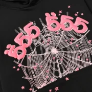 Closeup detail of the Sp5der Black Angel Number hoodie featuring a pink puff print 555 and spider web graphic.