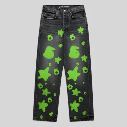 Front view of Sp5der Beluga Stamp Denim in faded black with neon green stamp and star graphic print patterns.