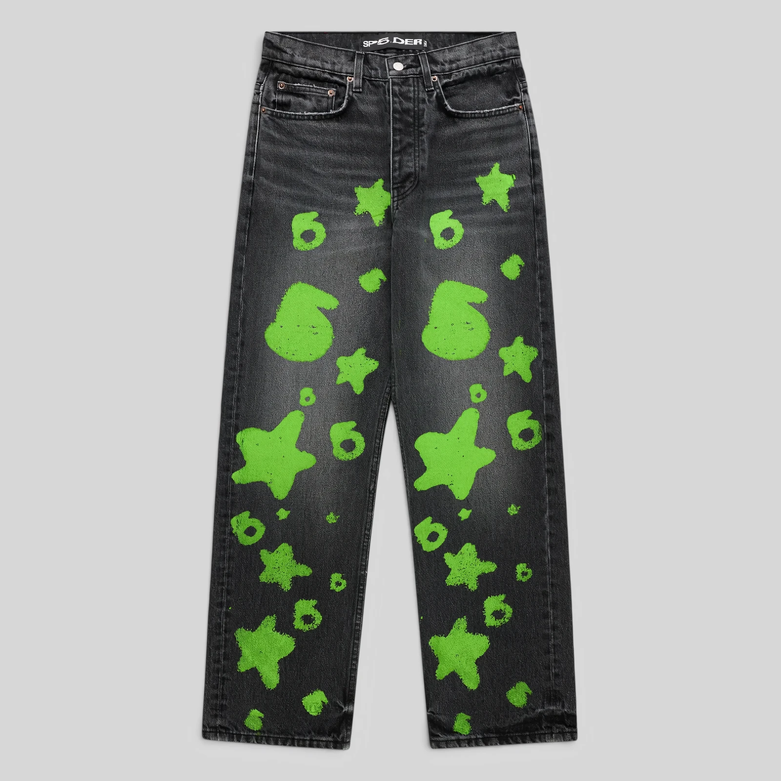 Front view of Sp5der Beluga Stamp Denim in faded black with neon green stamp and star graphic print patterns.