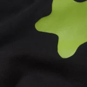 Close-up view of the Sp5der Beluga Tee in black, showing the premium cotton fabric and signature plastisol graphic.
