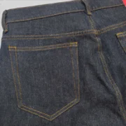 Close-up view of the premium Sp5der V3 Indigo Denim jeans showcasing the durable fabric and detailed stitching quality.