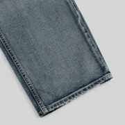Close-up view of the premium 13oz denim fabric texture from the Sp5der Light Blue Wash Denim Work Pant streetwear.