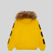 Back view of the Sp5der Yellow Fur Hooded Zip Up Sweatshirt showing the faux fur hood and patterned sleeve details.