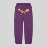 Front view of the purple Sp5der OG Web V2 sweatpants featuring signature yellow branding and star graphic details.
