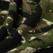 A detailed close-up shot of the high-quality tiger camo print on the 100% cotton fleece Sp5der OG Web V2 sweatpants.