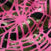 Close-up of the Sp5der OG Web V2 Hoodie in Tiger Camo, showing the signature bright pink web puff print on cotton.