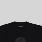 Detailed close up of the black Sp5der Oversized Reunion tee showing the branding and fabric quality