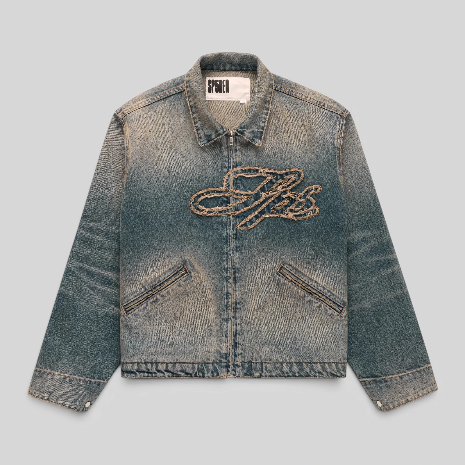 Front view of the Sp5der Script Denim Work Jacket in light wash denim featuring signature frayed script embroidery.