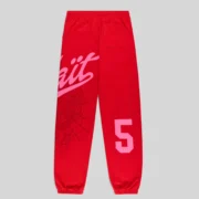 Back view of Sp5der Stadium sweatpants in red featuring a pink Wait script, spider web, and 5 graphic print.
