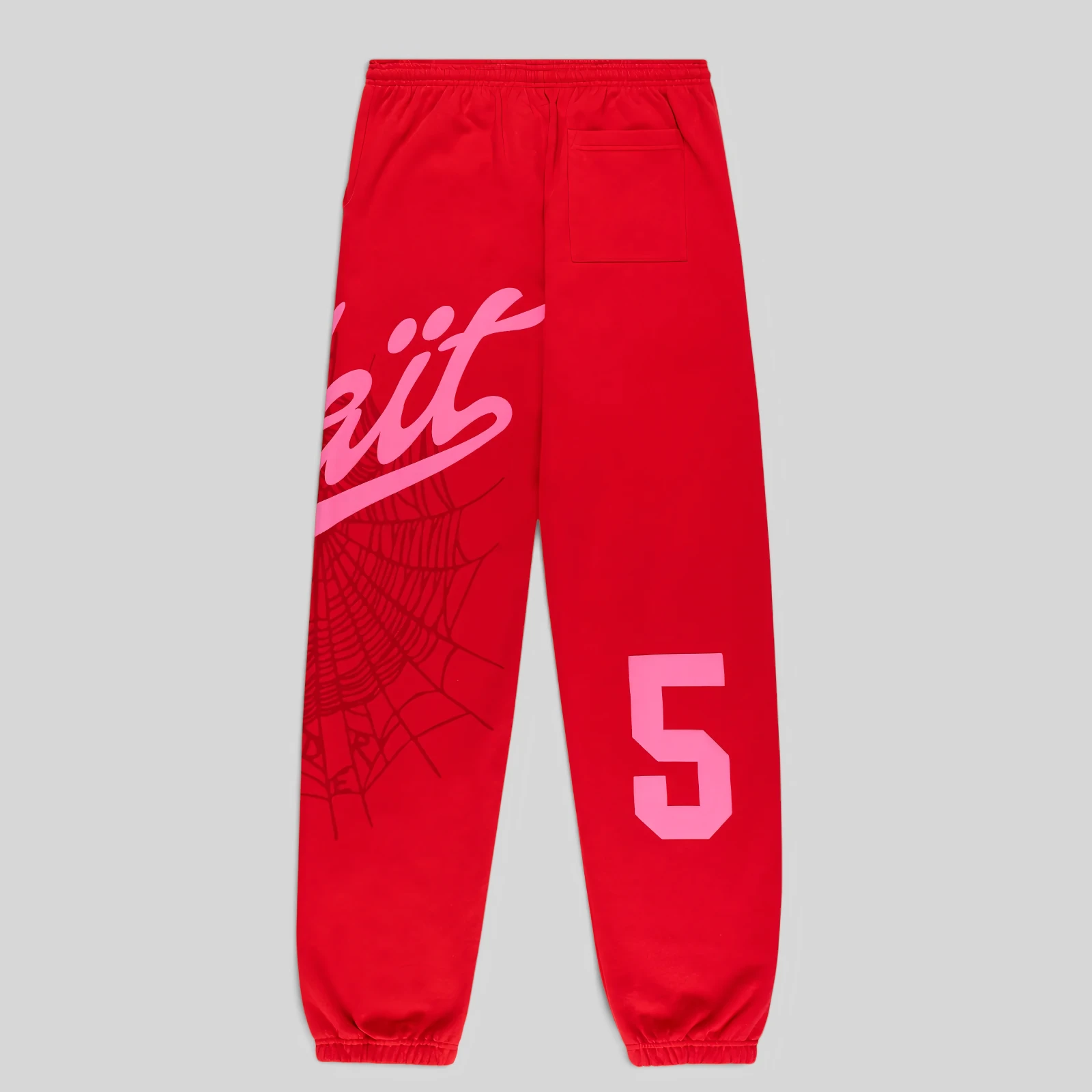 Back view of Sp5der Stadium sweatpants in red featuring a pink Wait script, spider web, and 5 graphic print.