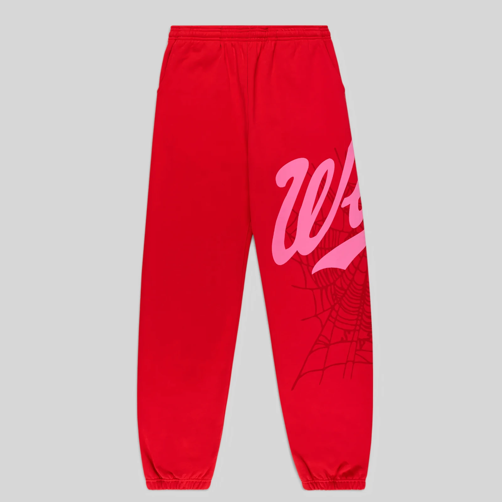 Front view of authentic red Sp5der Stadium sweatpants featuring pink Wait script text and intricate web graphic print.