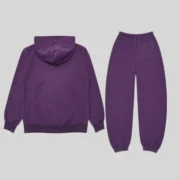 Back view of the purple Sp5der Web tracksuit featuring a matching hoodie and sweatpants on a plain grey background.