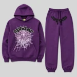 Front view of the Sp5der Web Tracksuit in purple featuring an iconic pink web graphic and signature SP5DER branding.